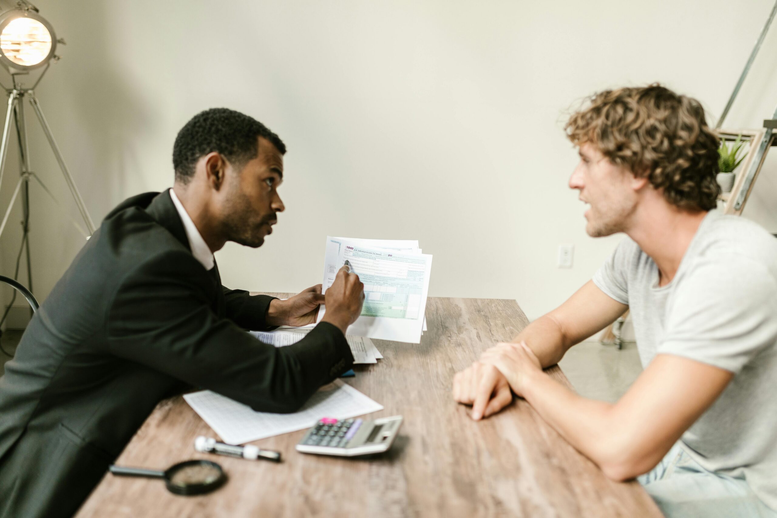 A business professional reviewing customer notes while speaking with a clien
